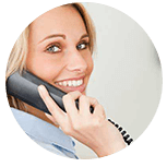 Woman talking on desktop phone